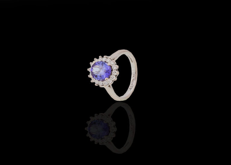 CI0002081 - 4.9 grams 18 carat White Gold Tanzanite & Diamond Browns Halo Ring