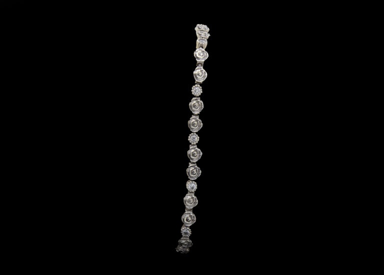 CI0002200 - 13 grams 9 carat White Gold Rose Design Diamond Tennis Bracelet