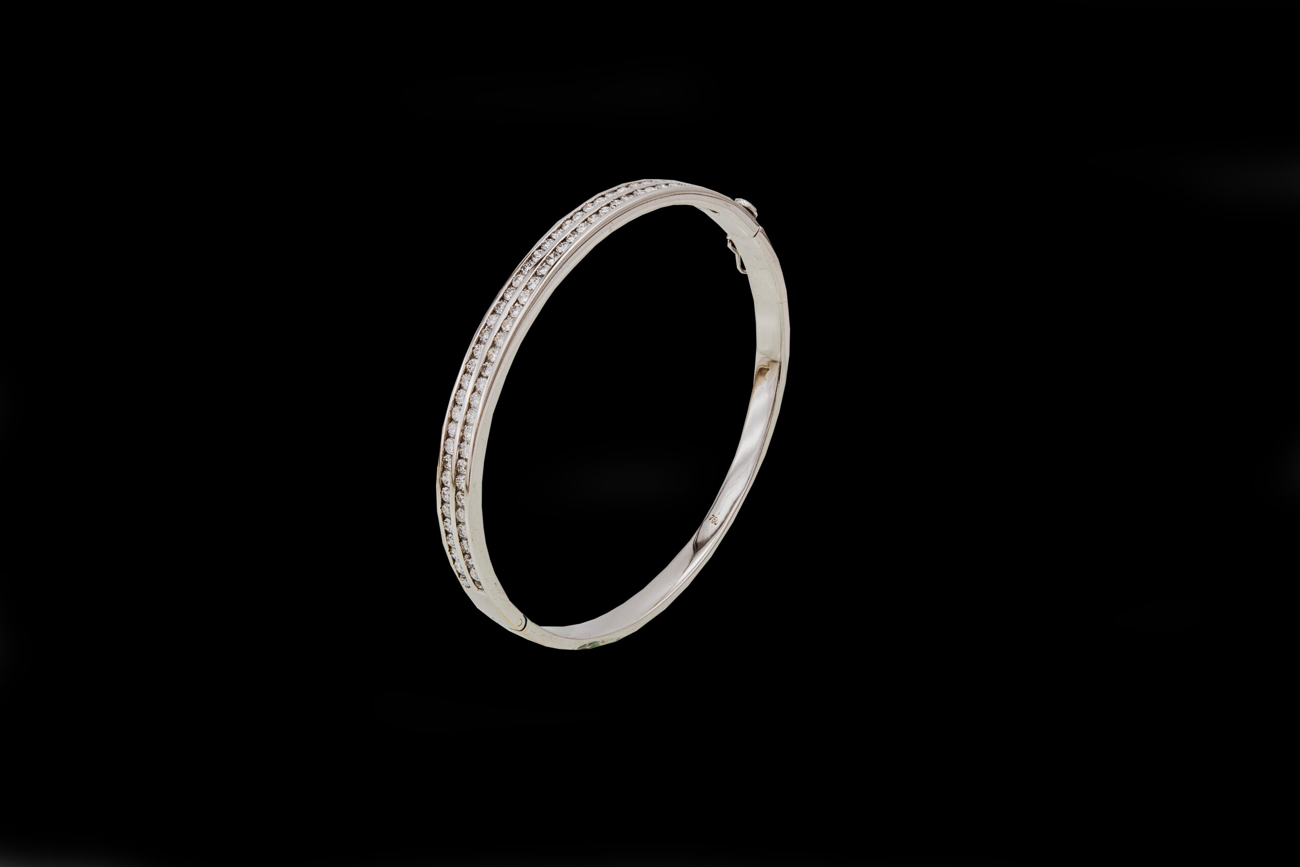 CI0001108 - 23.7 grams 18 carat White Gold Diamond Bangle